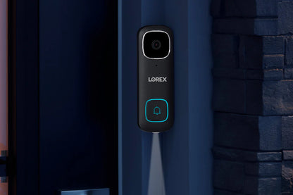 Lorex doorbell on a blue door with stone wall background